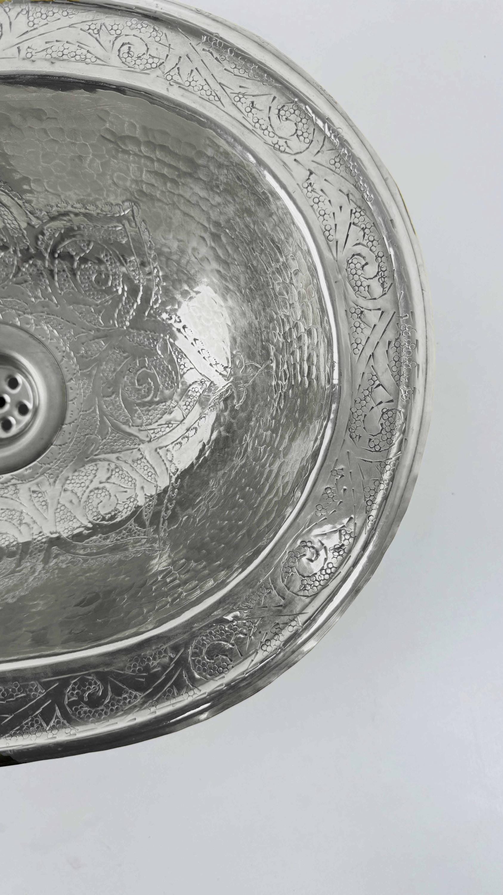 silver engraved sink
