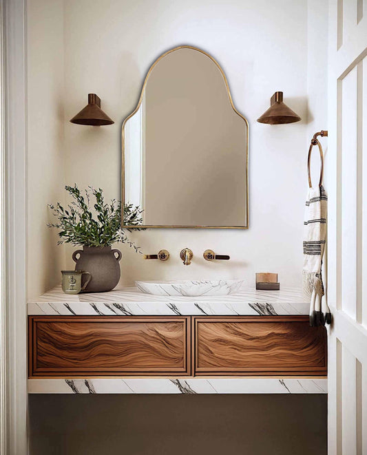 brass arch mirror in powder room