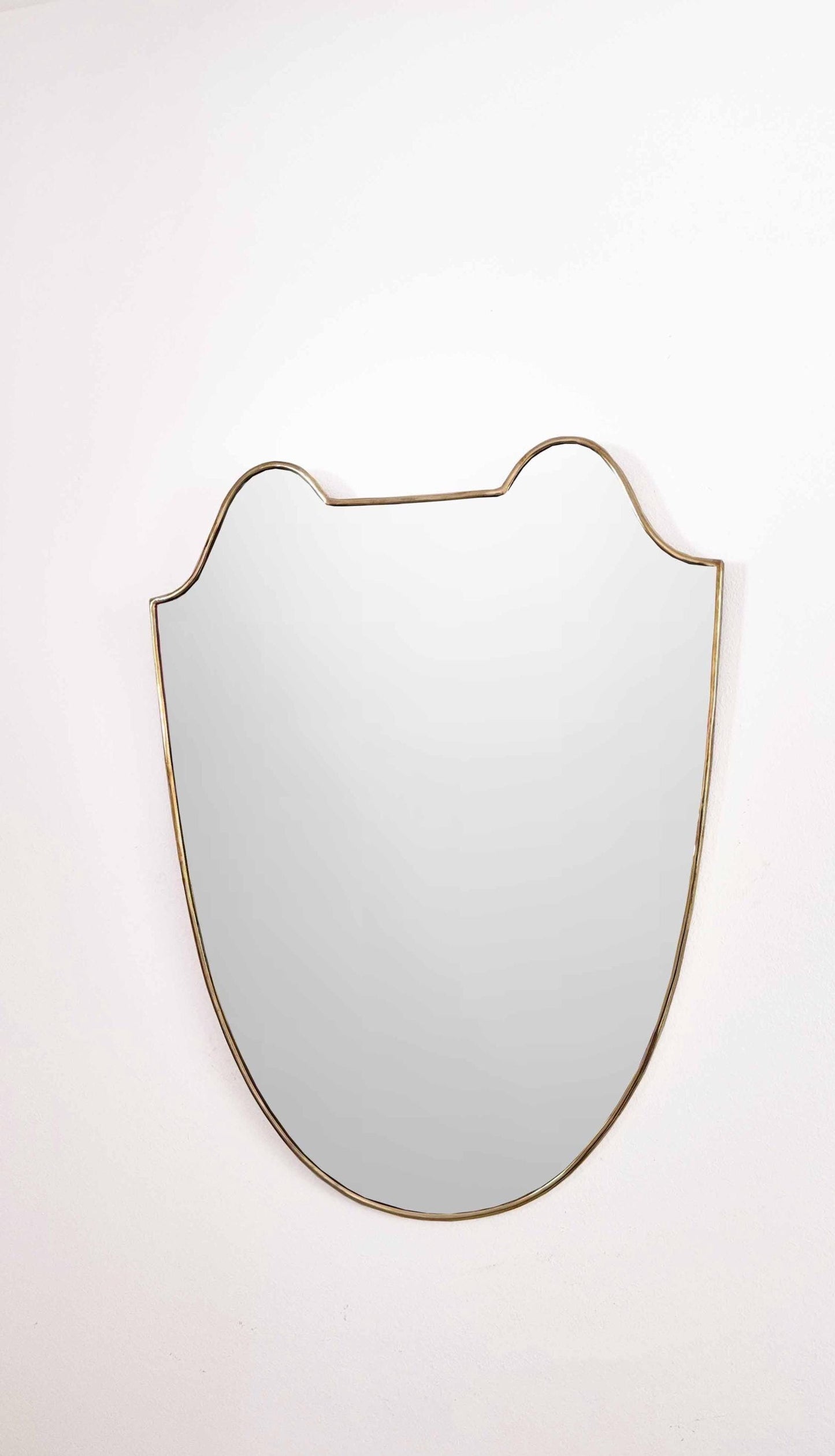 unlacquered brass mirror