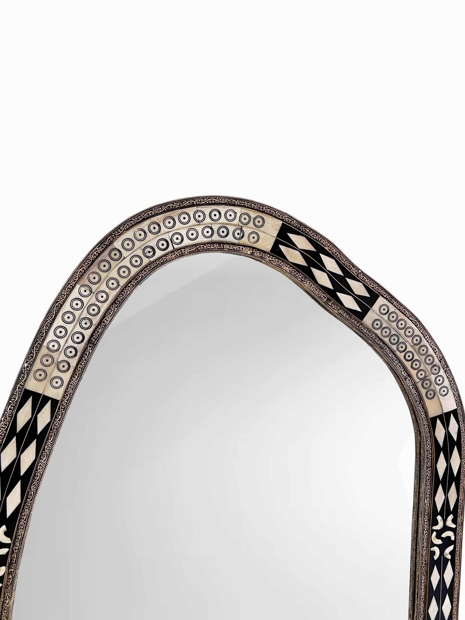 Asymmetrical bone frame Mirror in white background