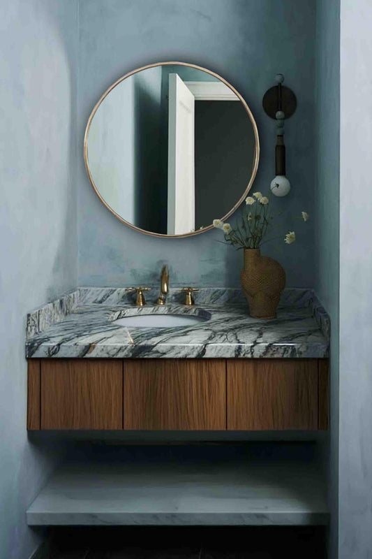 gold brass round mirror in powder room