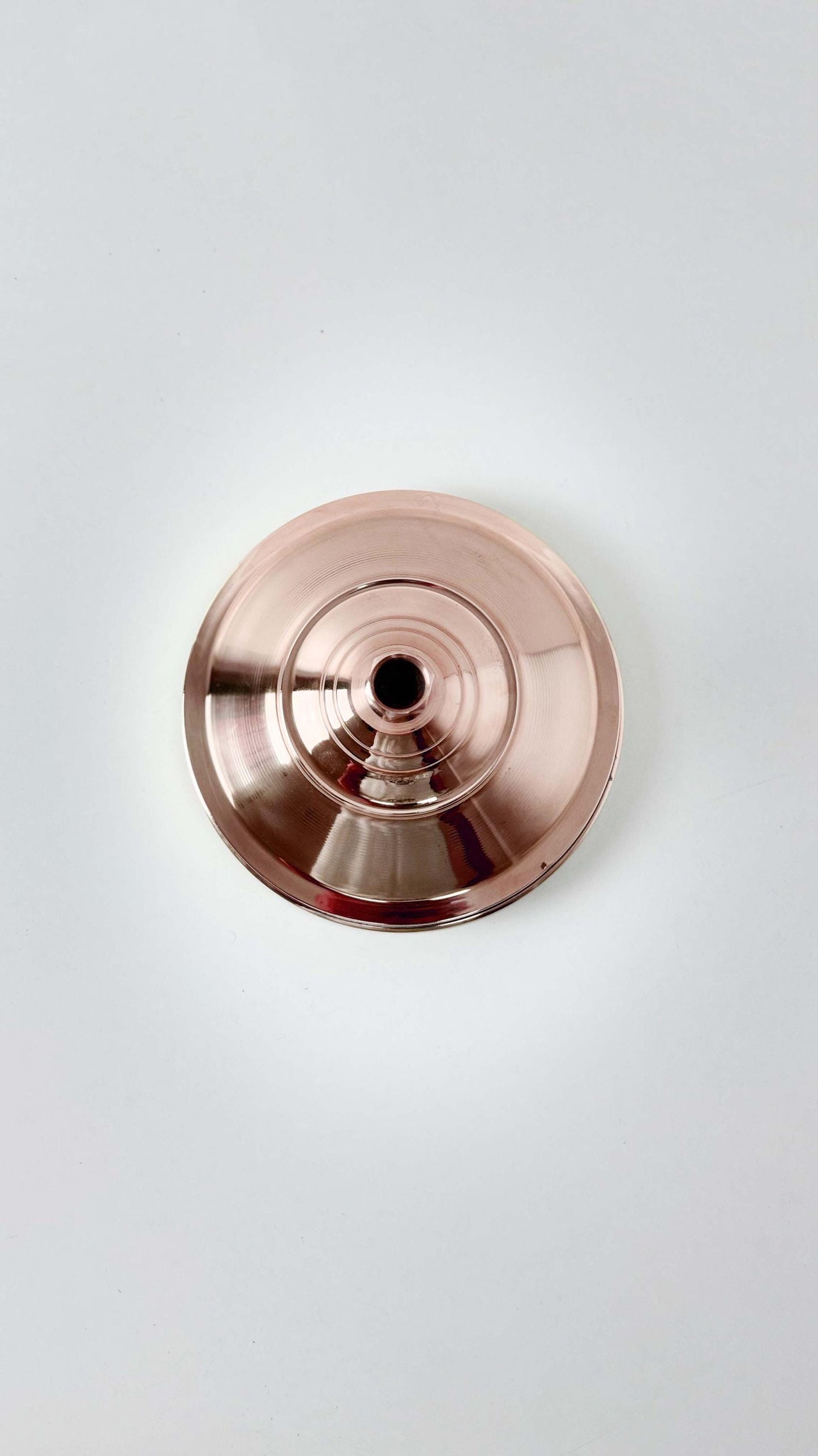 back of Copper Shower head in white background