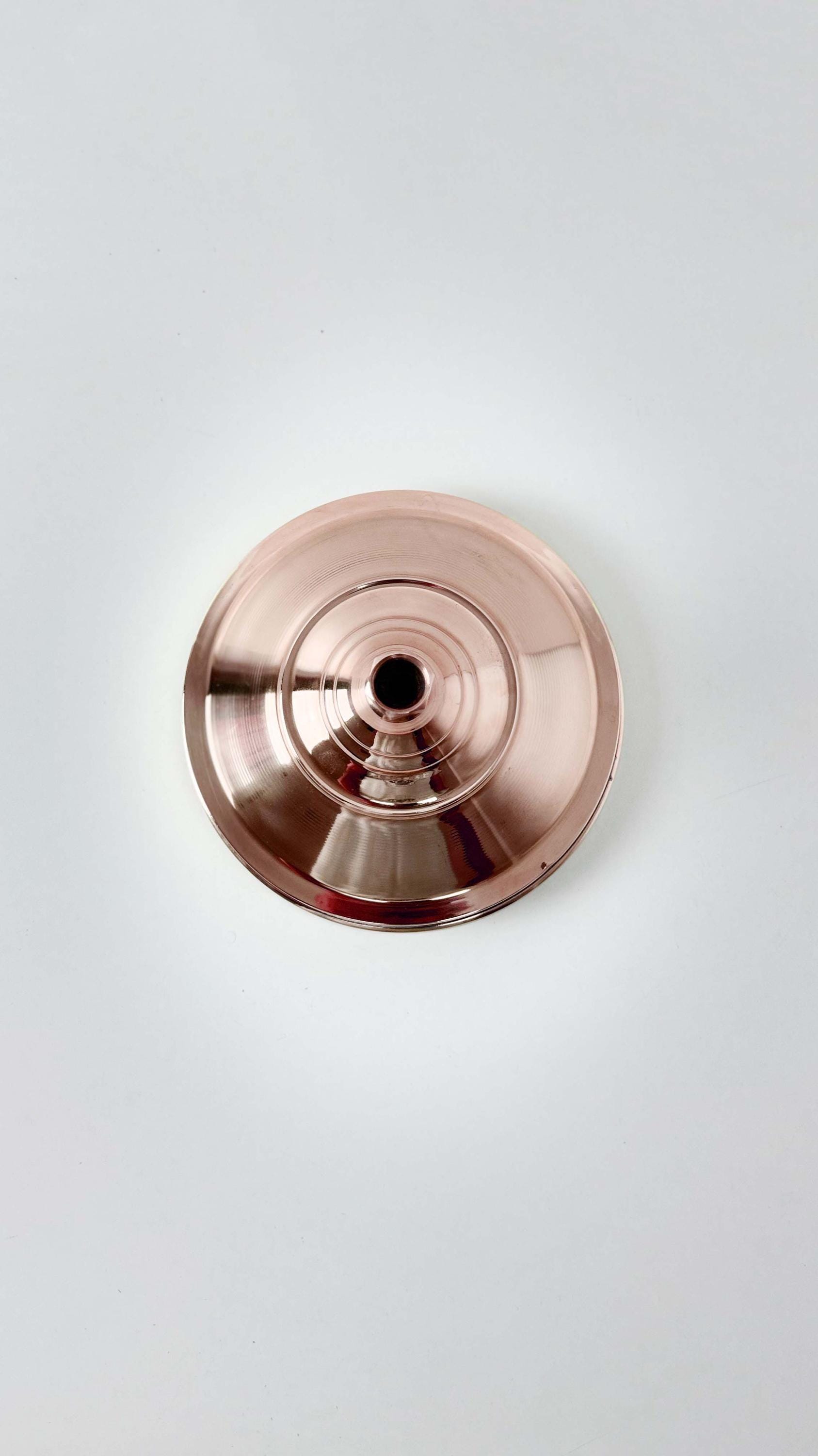 back of Copper Shower head in white background