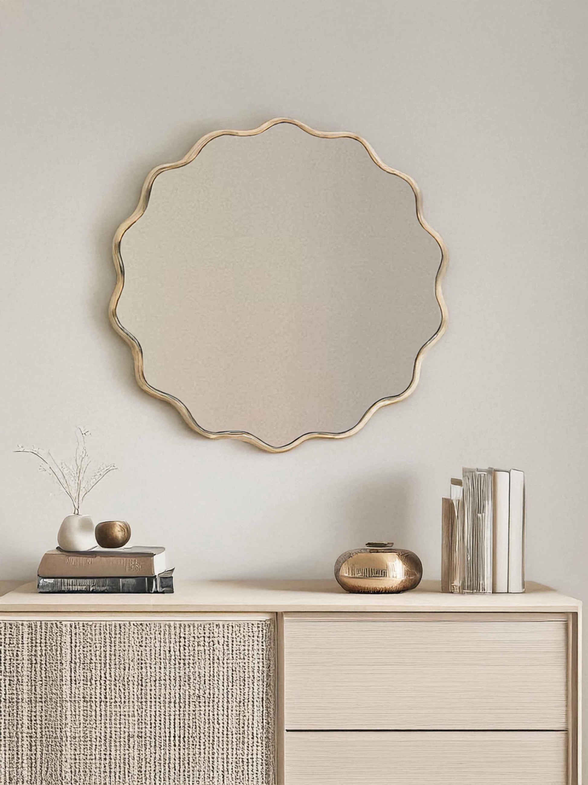 Round mirror over wooden vanity