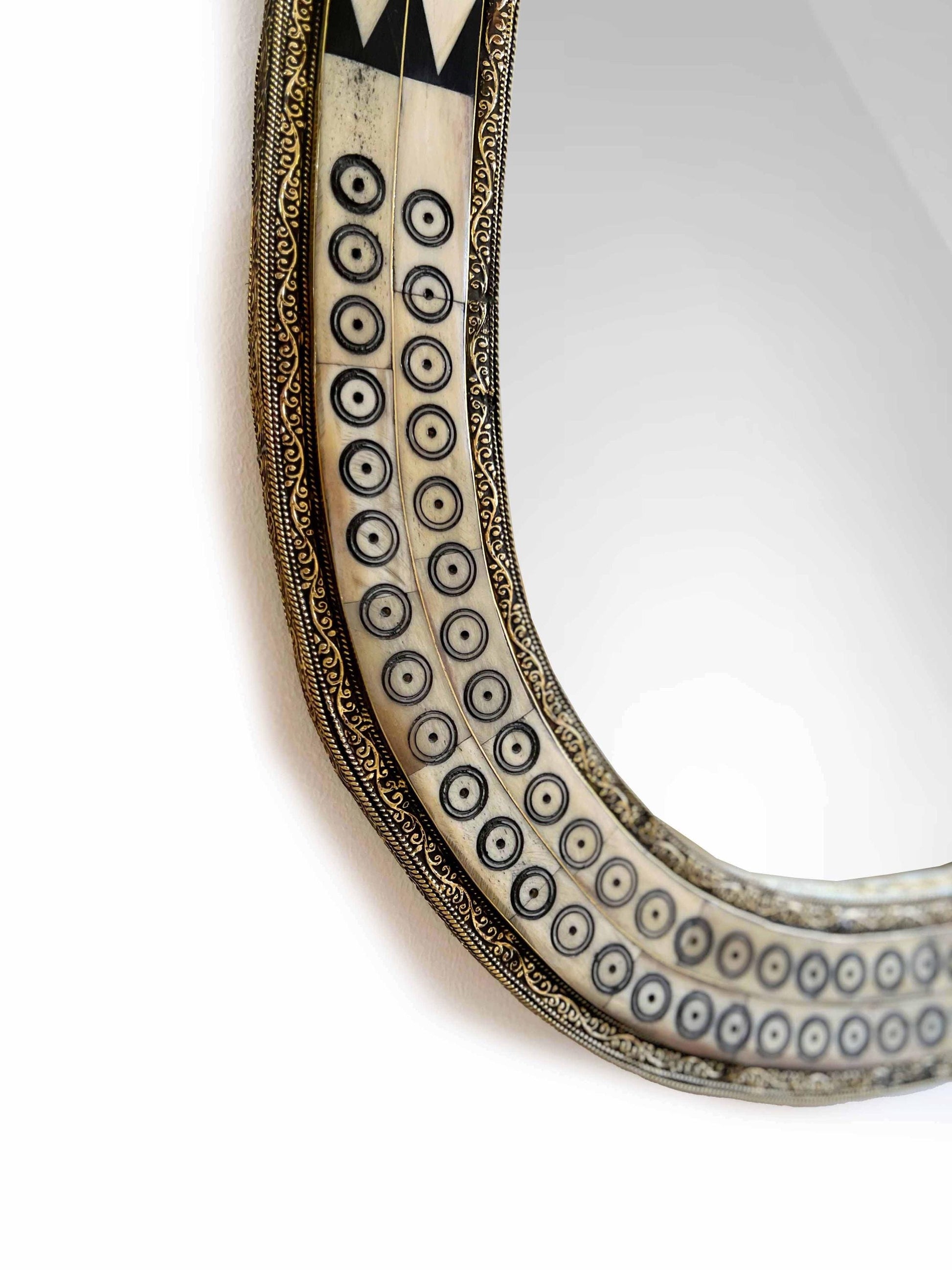 Asymmetrical bone frame Mirror in white background
