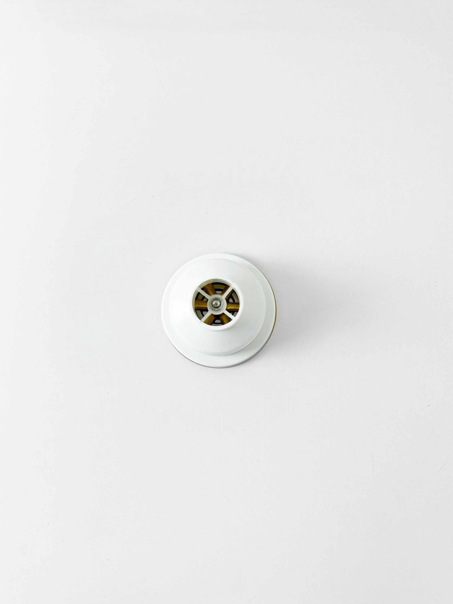back of Unlacquered Brass Kitchen Sink Strainer