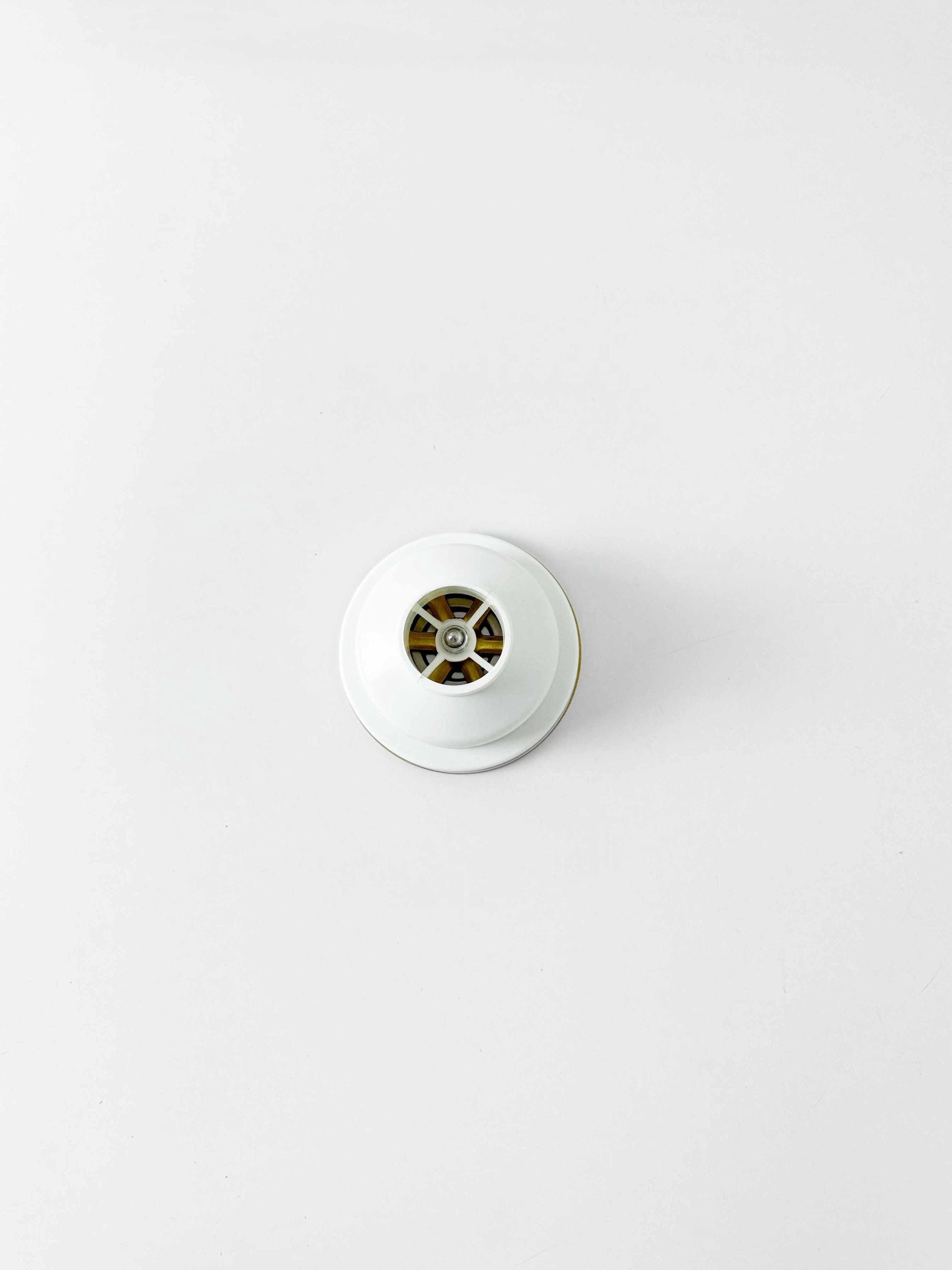 back of Unlacquered Brass Kitchen Sink Strainer