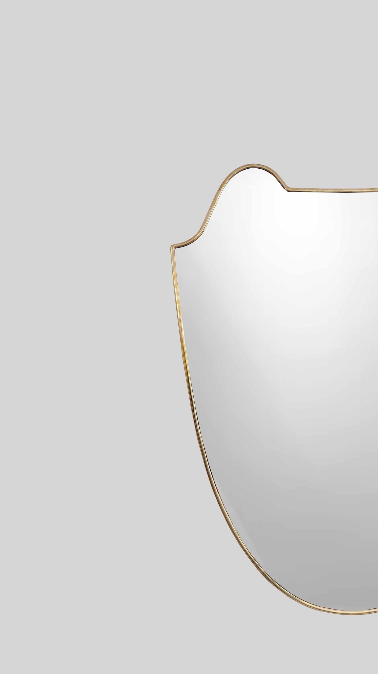unlacquered brass frame mirror