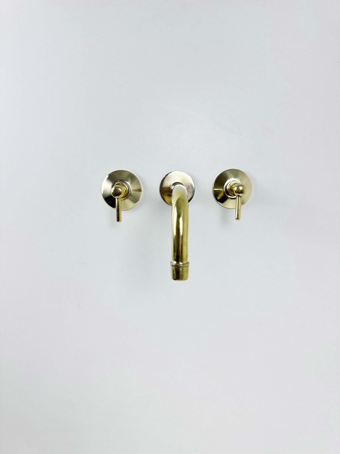 Unlacquered Brass Wall Mount Faucet on white background