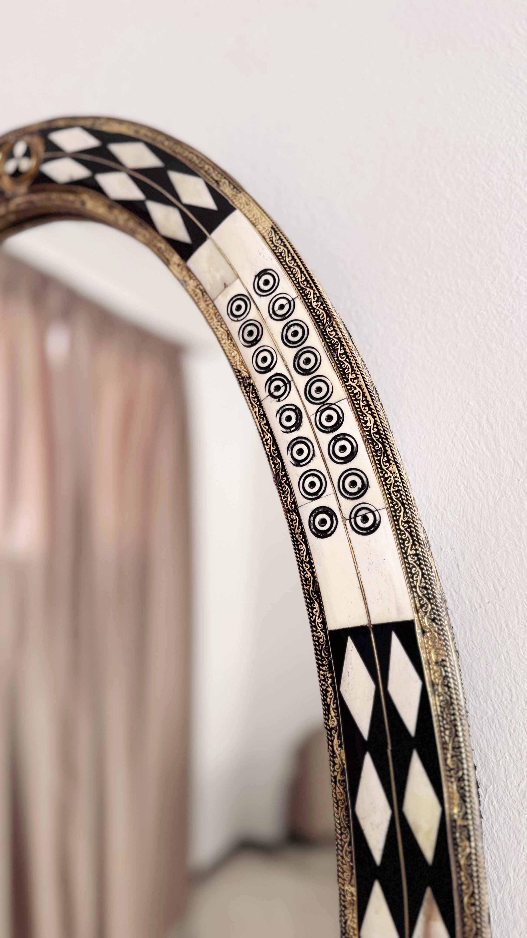 bone and brass frame wall mirror
