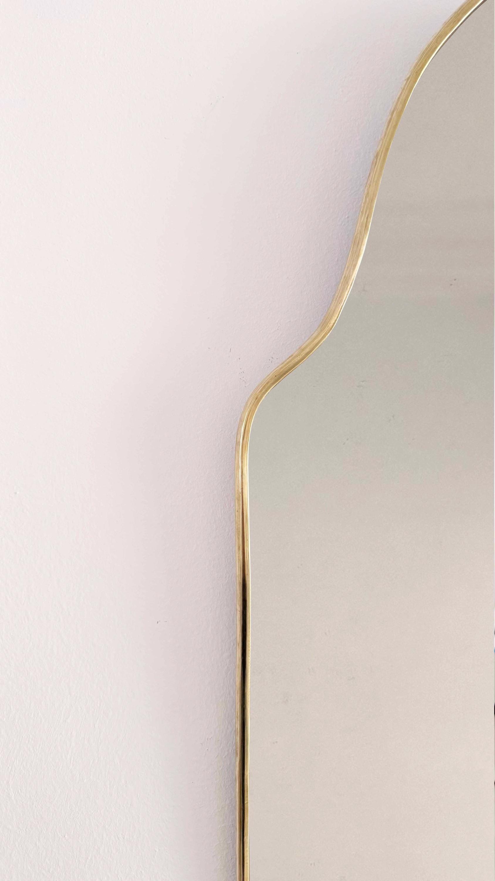 arch brass mirror frame in white background