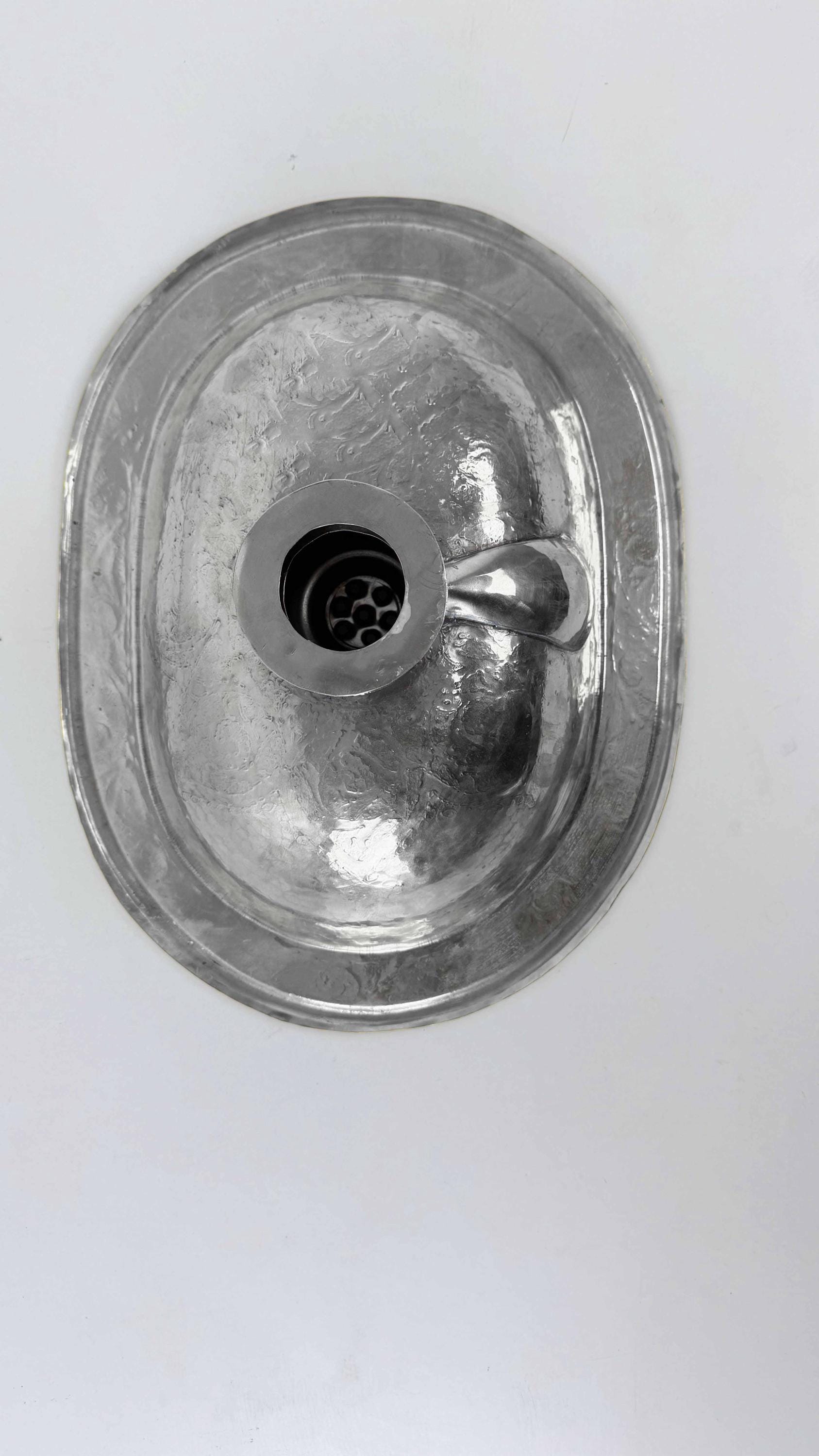 back of silver sink