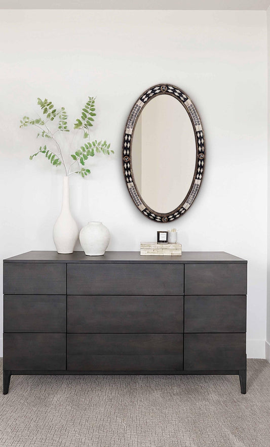 bobe and brass frame mirror in a living room