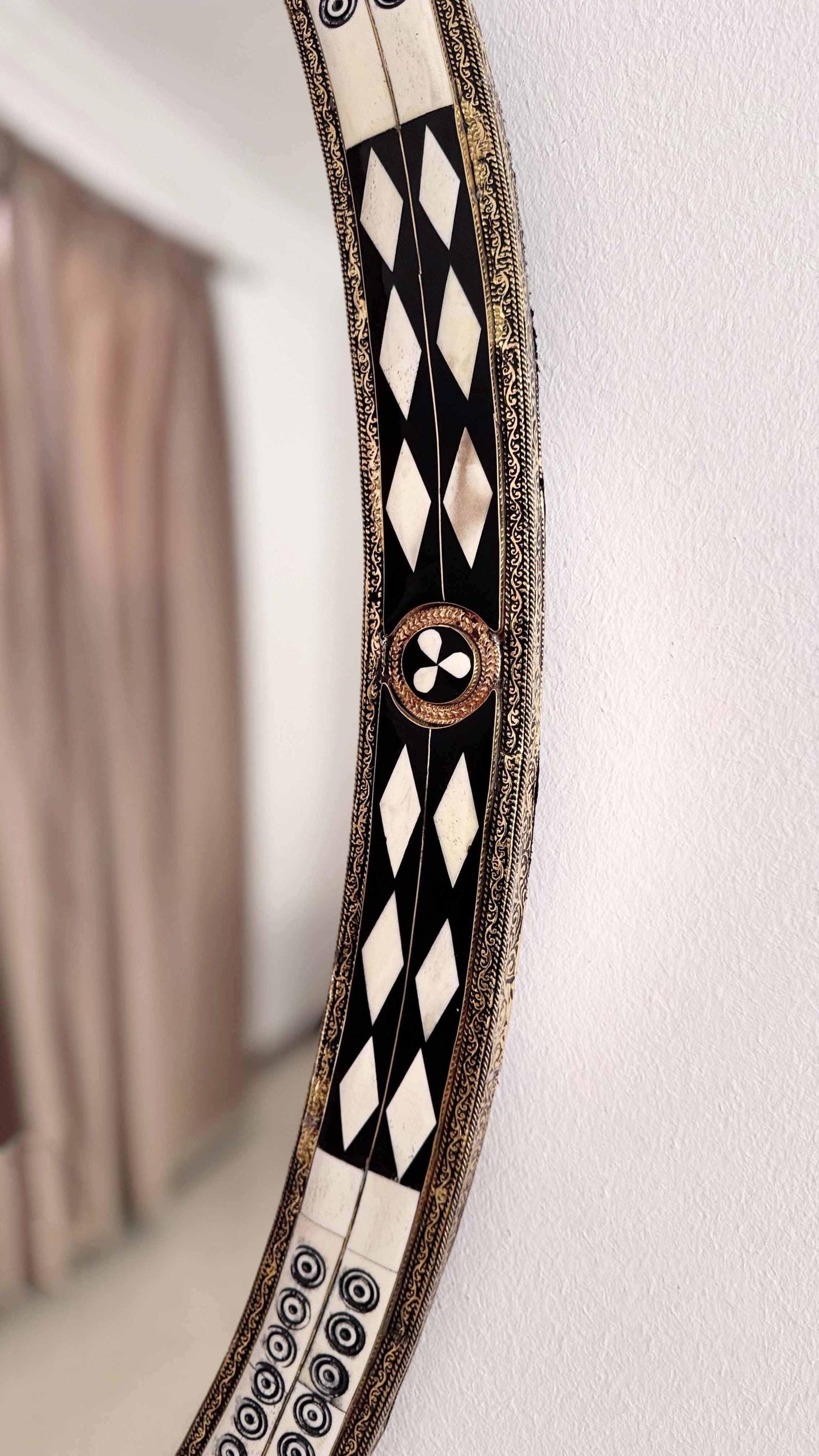 bone and brass frame mirror