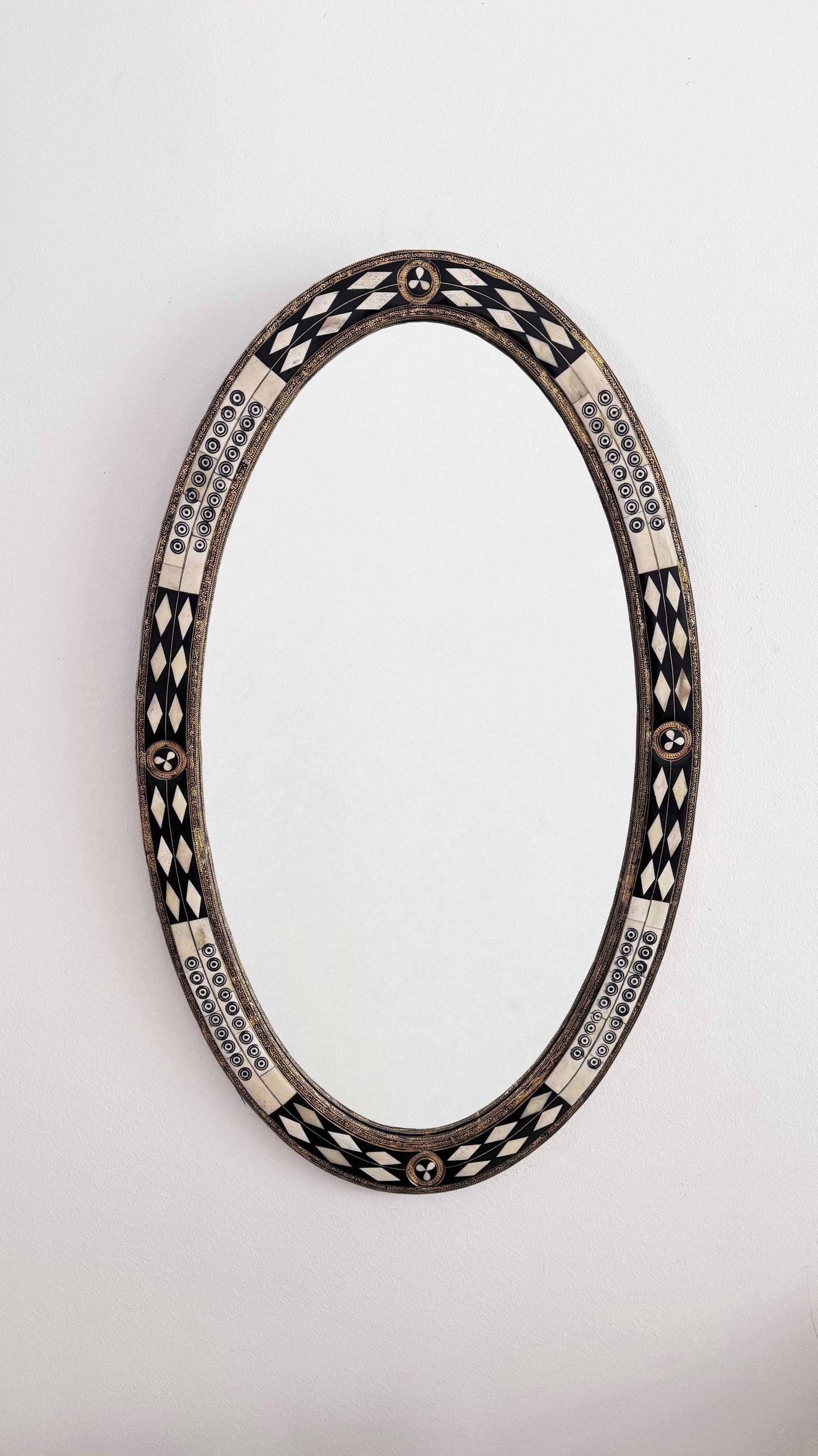 bone and brass frame oval mirror