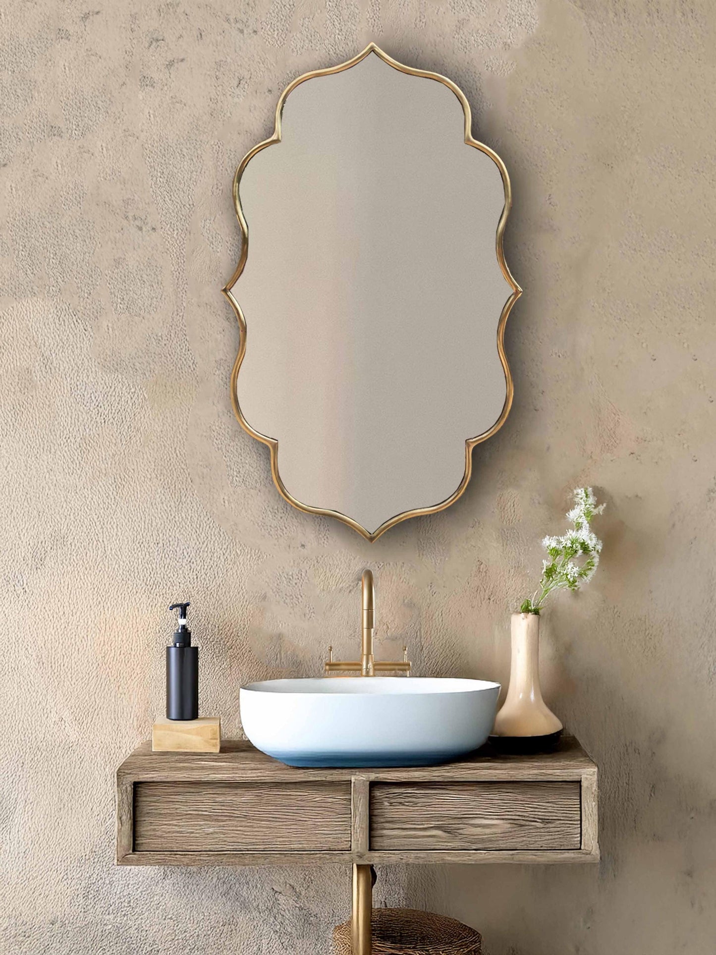 Gold asymmetrical mirror with floating vanity.