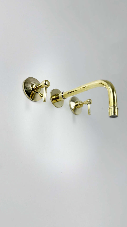Unlacquered Brass Wall Mount Faucet on white background