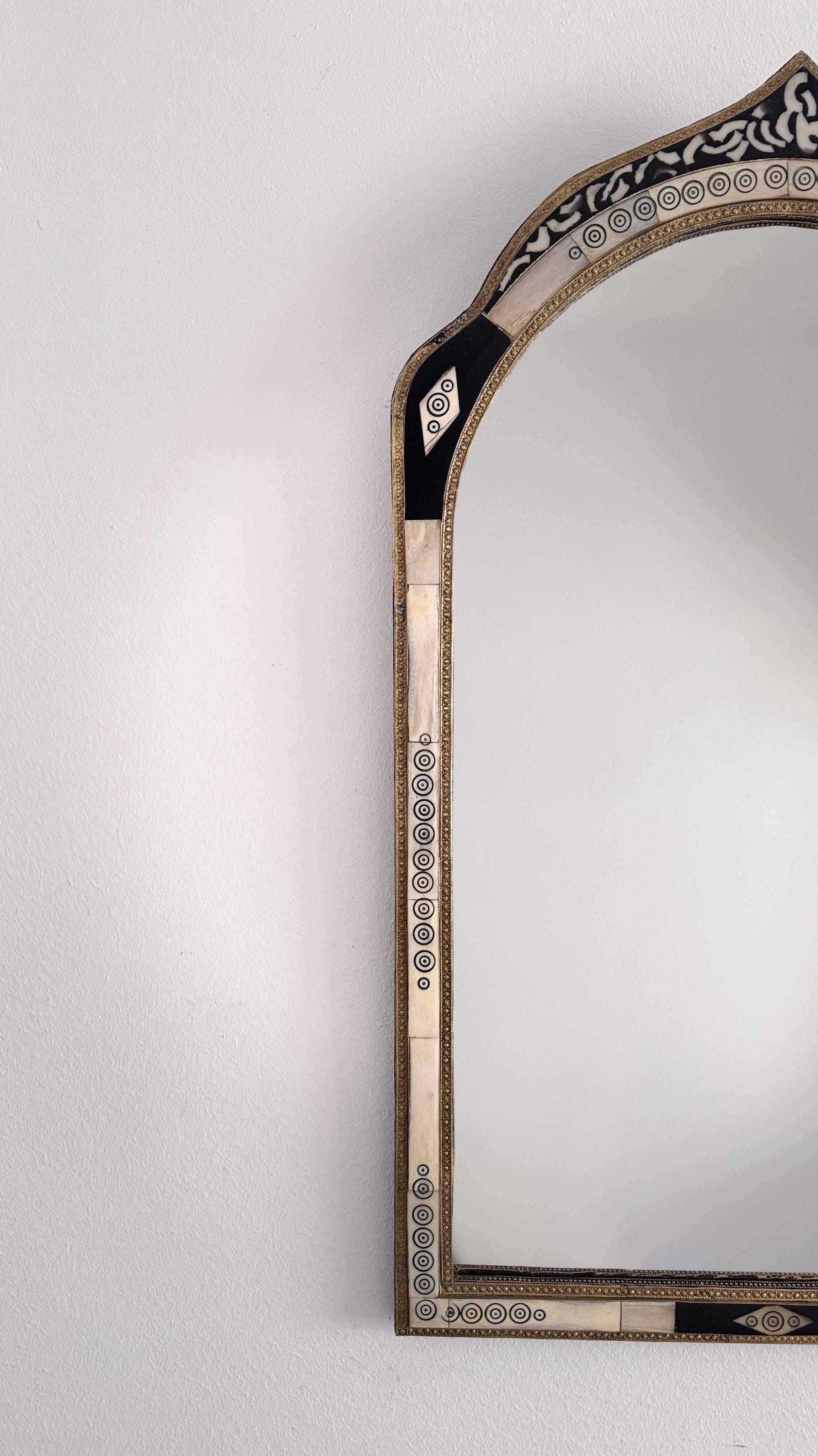 arch bone and brass mirror