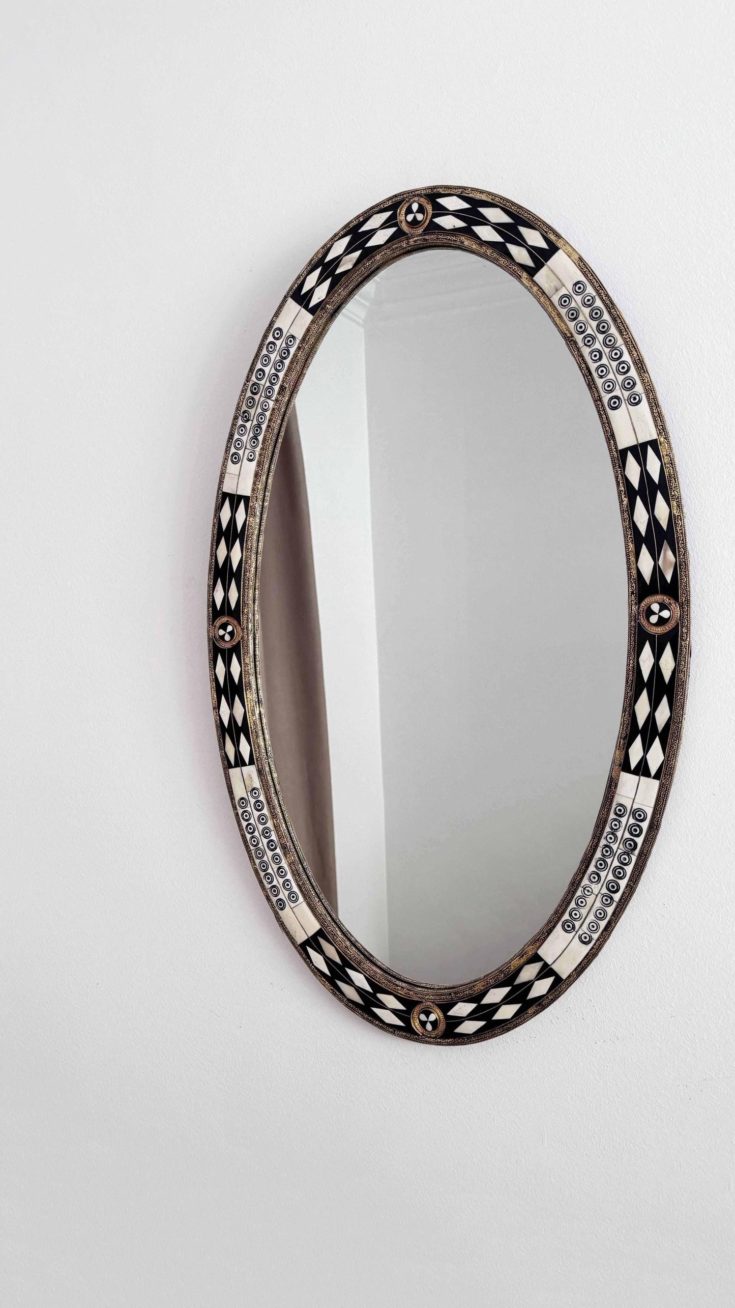 bone and brass frame oval mirror