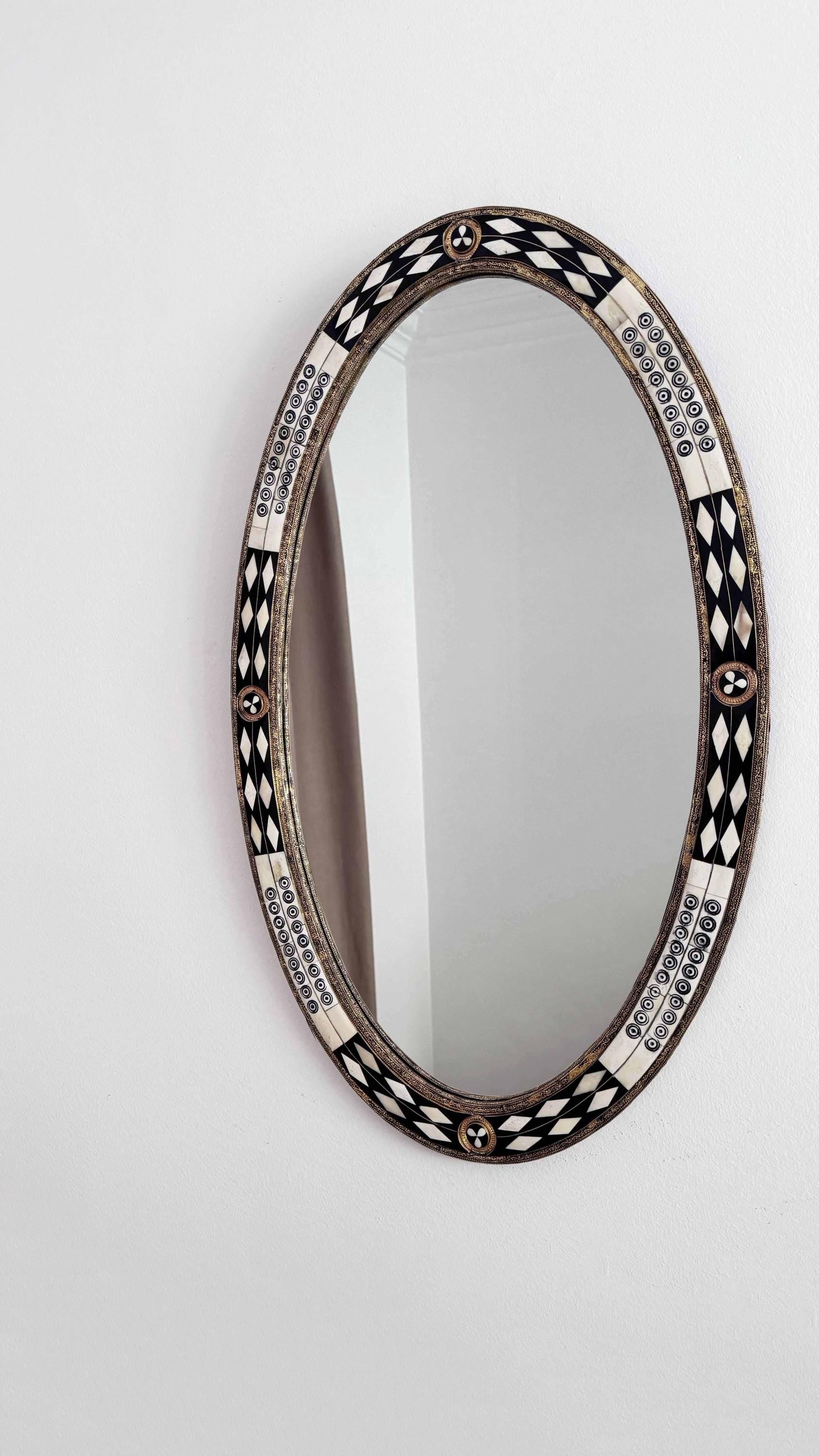 bone and brass frame oval mirror