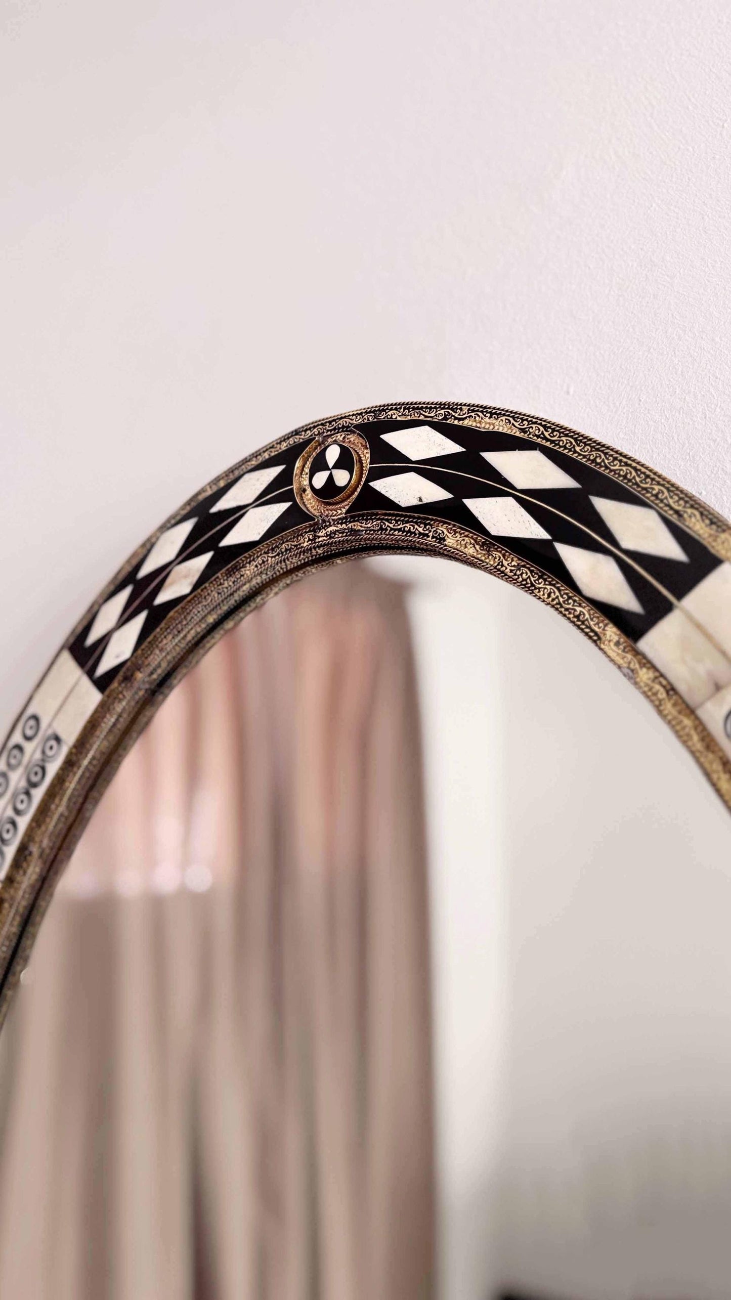 bone and brass frame mirror