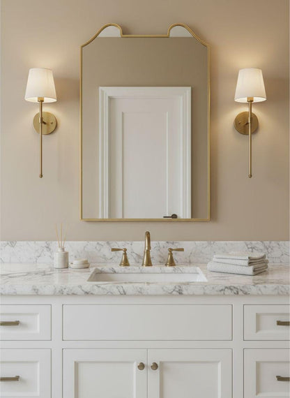 Antique château gold mirror over marble bathroom sink