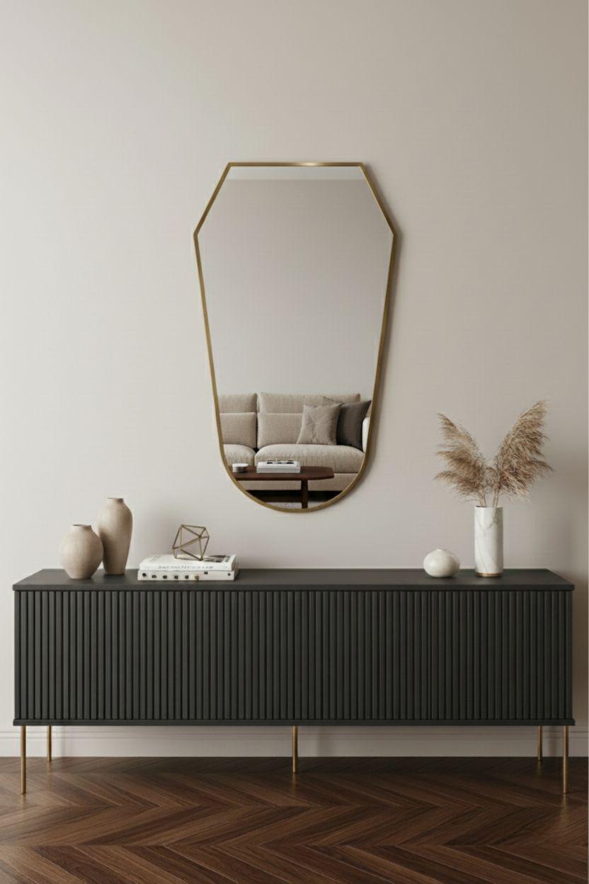 shield brass mirror above modern console