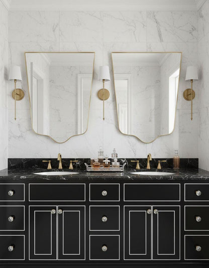 Double shield brass mirrors in marble bathroom