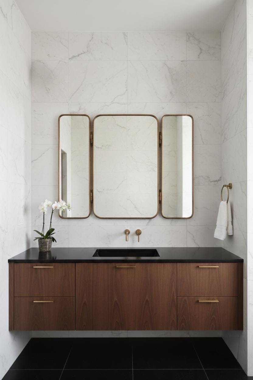Three panel foldable brass bathroom mirror above wooden vanity