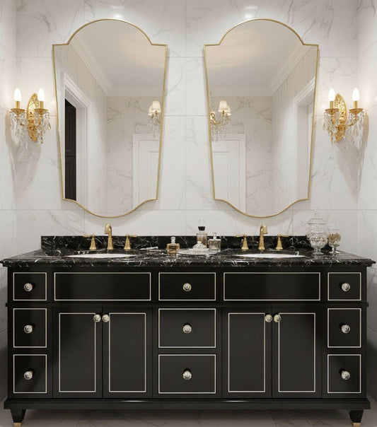 Pair of asymmetrical brass bathroom mirrors over double vanity