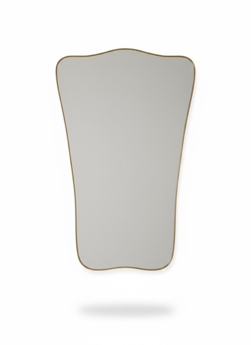 Asymmetrical brass mirror silhouette in a white background