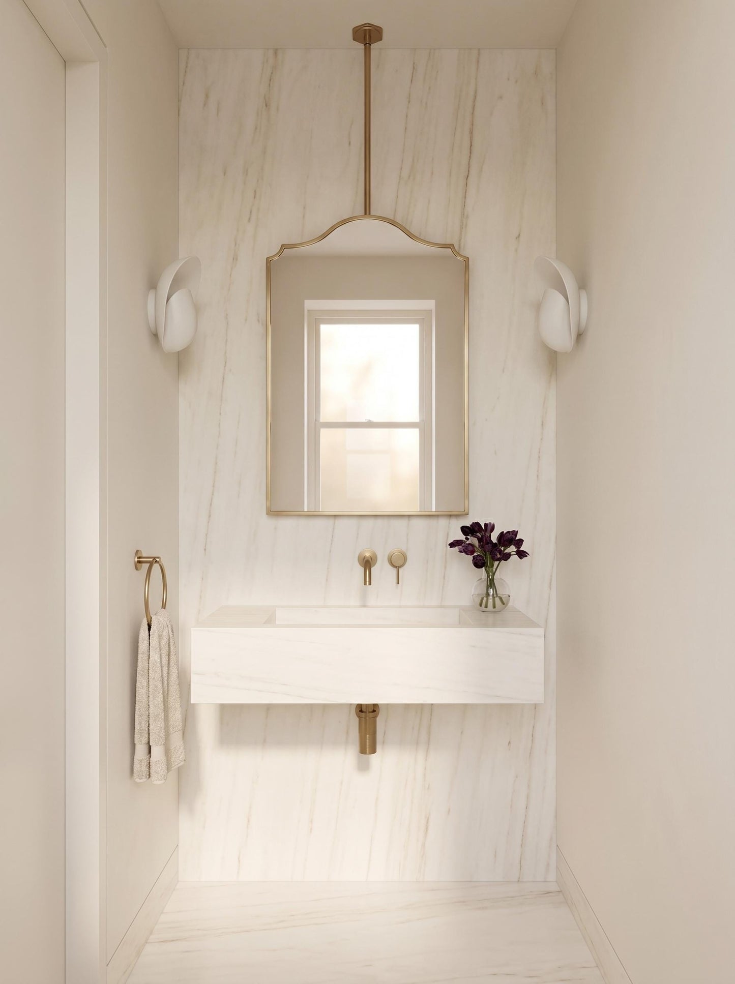 Modern brass vanity mirror above marble floating sink