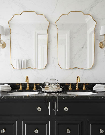 Double brass crest mirrors over marble bathroom sinks