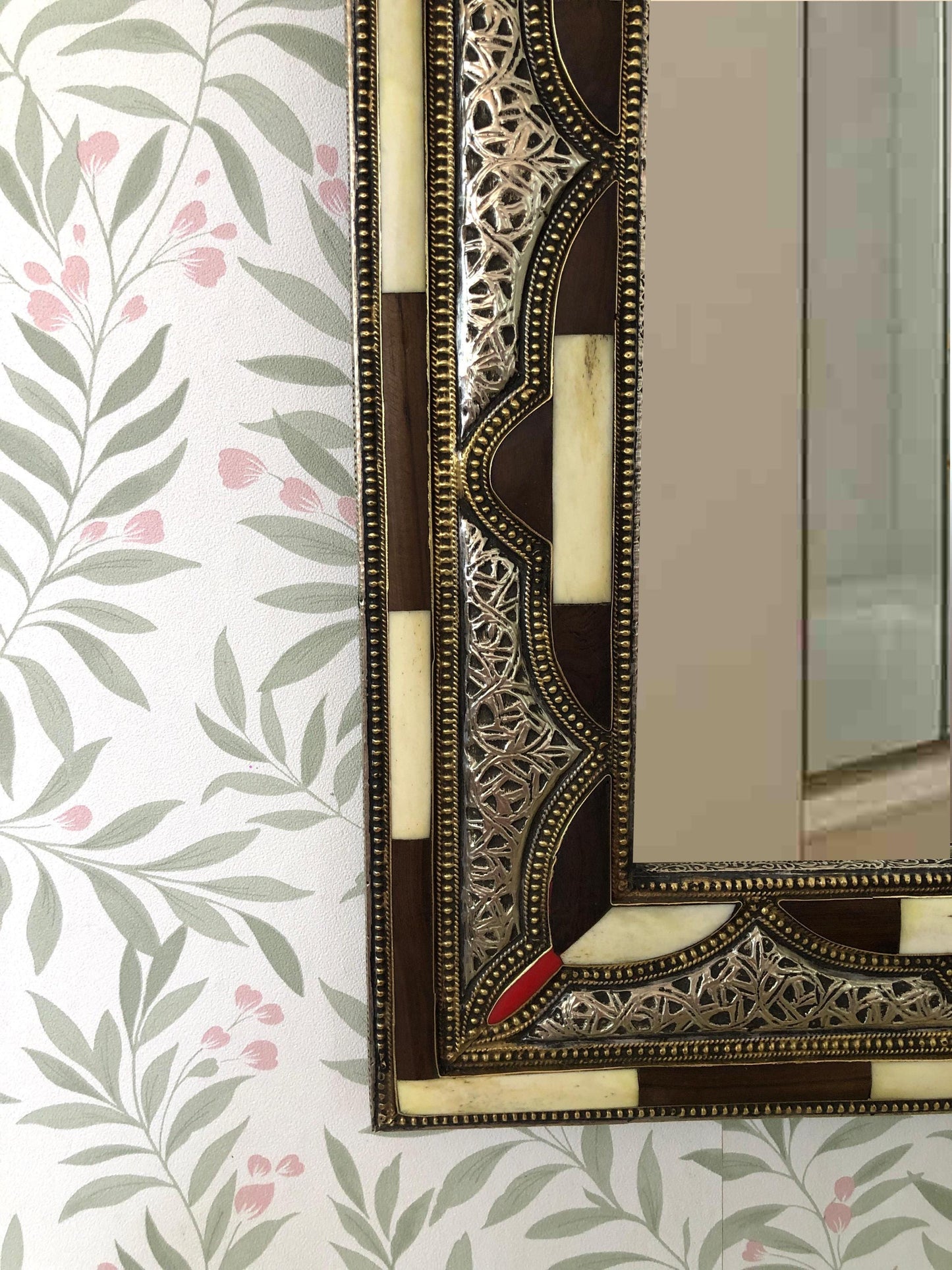 Zoomed-in look at decorative edge of Bone Mirror