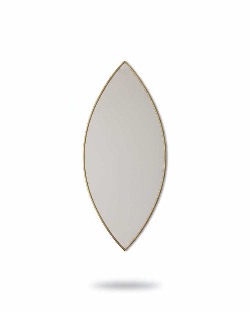Handmade pointed oval brass wall mirror on white background