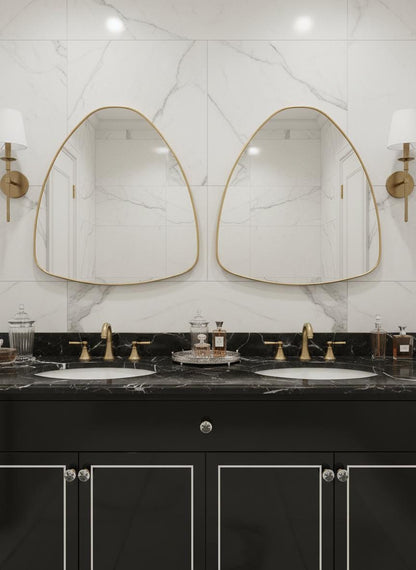 Double irregular brass bathroom mirrors over marble vanity