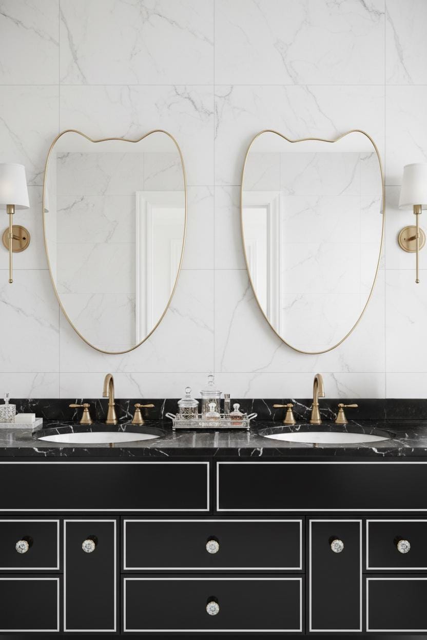Pair of curved brass crest mirrors in luxury bathroom