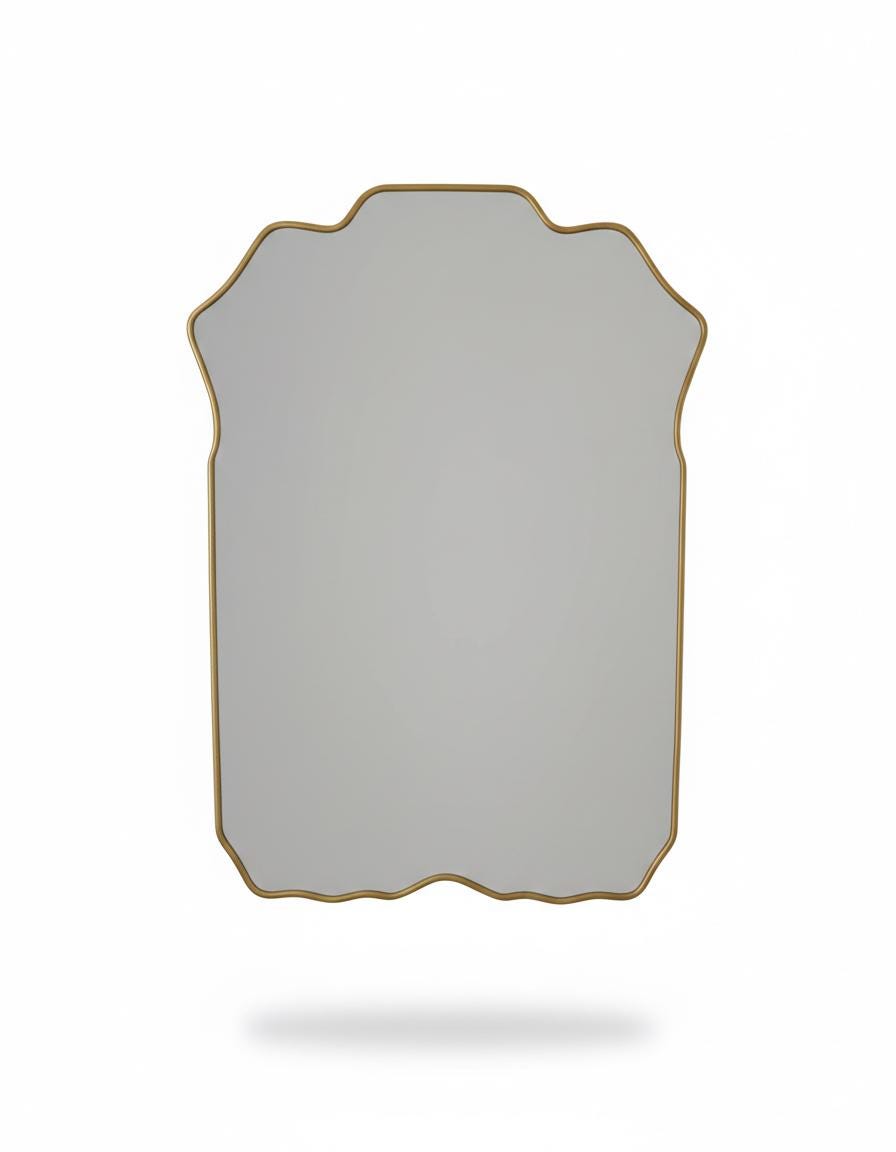 Curved scalloped brass mirror  in a white background.