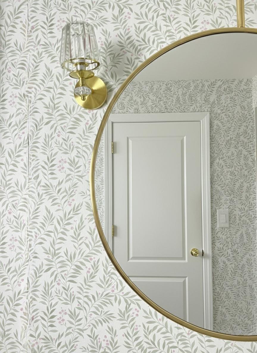 Close-up edge detail of handmade brass round mirror