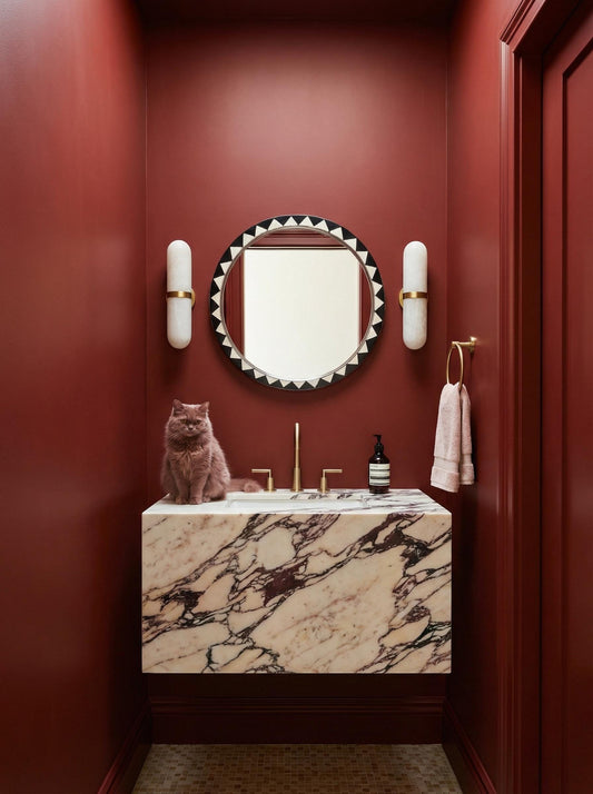 Black and white Moroccan round mirror in bold red bathroom interior