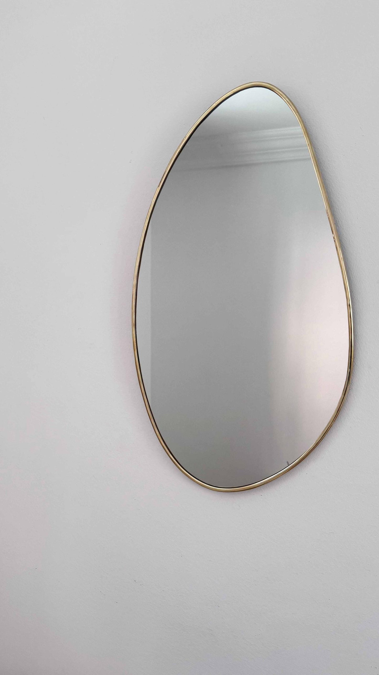 Handmade Brass Mirror in white wall