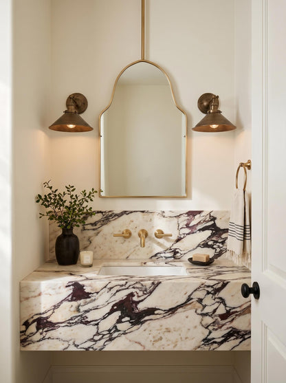 Ceiling mounted brass vanity mirror with marble countertop