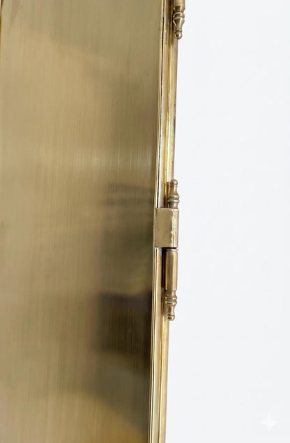 Close-up of brass hinge and back panel detail
