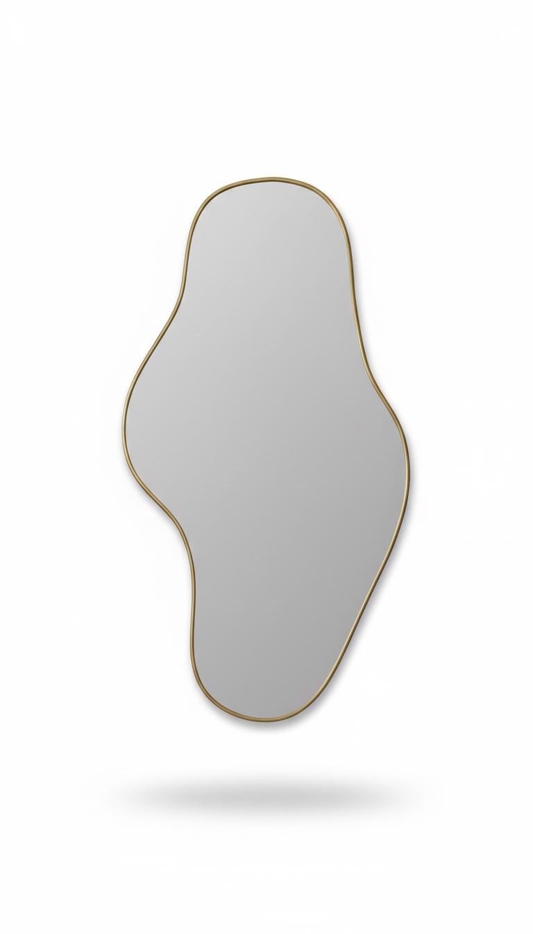 Asymmetrical brass mirror in a white background