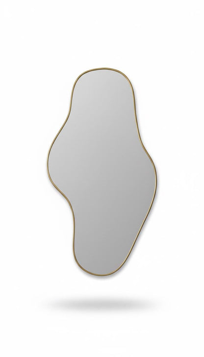 Asymmetrical brass mirror in a white background