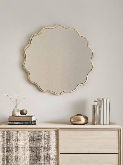 Round mirror over wooden vanity