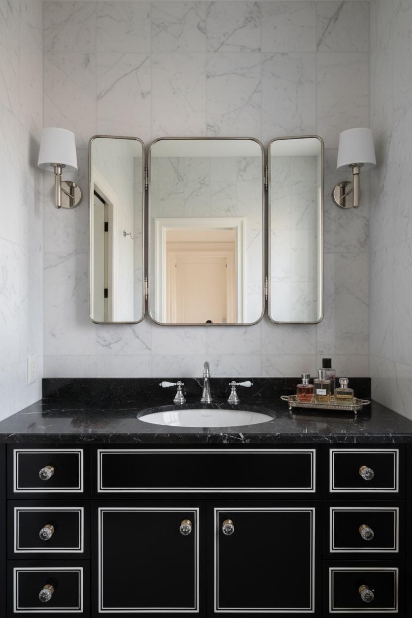 Triple panel brass bathroom mirror over black vanity