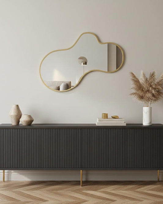 Asymmetrical brass mirror with organic curved silhouette
