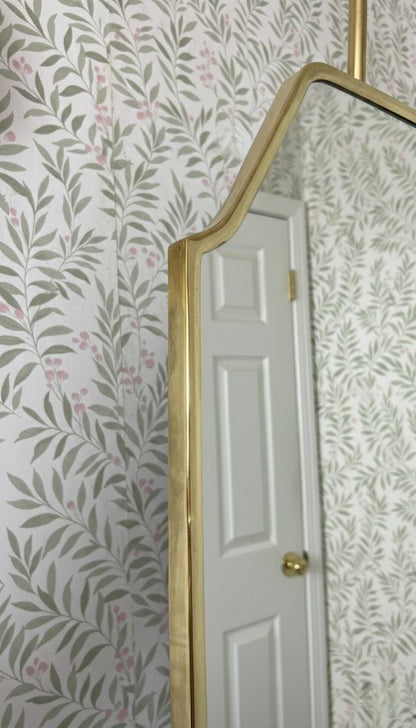 Close-up of handcrafted brass frame detail