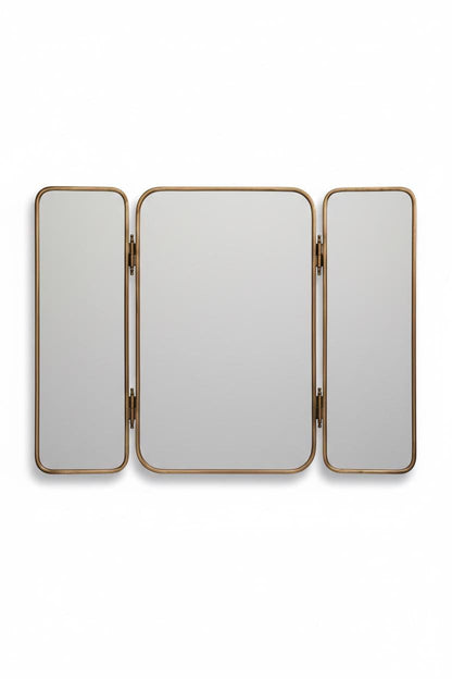 Three panel foldable brass bathroom mirror in a white background